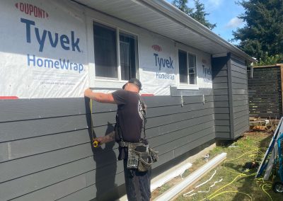 Shuswap Structures adding grey siding